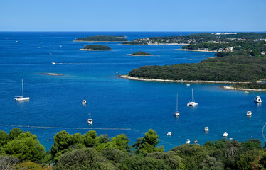 Seascape of Adriatic sea, Vrsar (Orsera), Istria, Croatia. Sailboats in blue sea