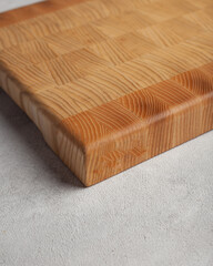 Wooden cutting board in the kitchen on a light background