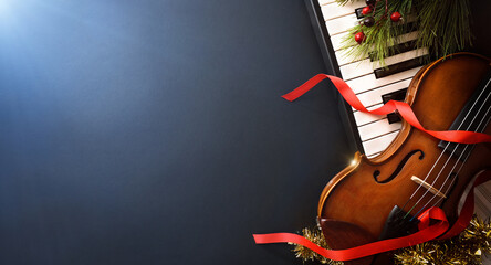 Christmas musical event with piano and violin and blue light