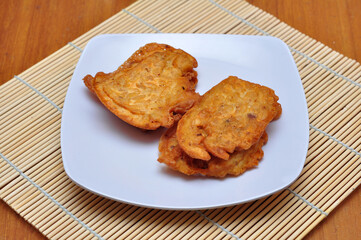 Fried tempeh flour ready to eat on a white plate
