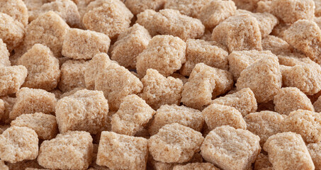 Cubes of brown cane sugar background