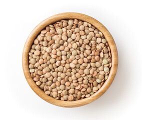 Uncooked green lentils in wooden bowl isolated on white background with clipping path