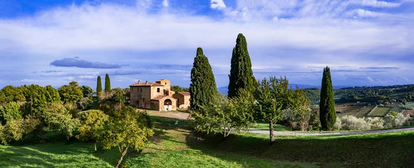 Fotobehang Romantic scenic Tuscany countryside. Typical scenery with cypresses. Montalcino town.  Italy, Toscana landscape © Freesurf