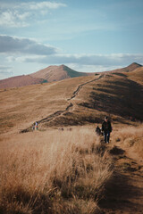 person in the desert, mountain path