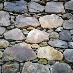 Dry stone wall background texture cloesup