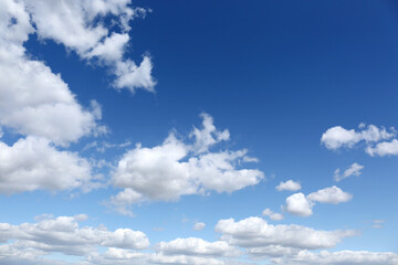 Picturesque view of beautiful fluffy clouds in light blue sky