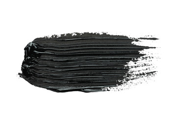 Brushstrokes of black oil paint on white background, top view