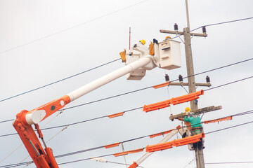 electrician work on crane fix high voltage elecric cable