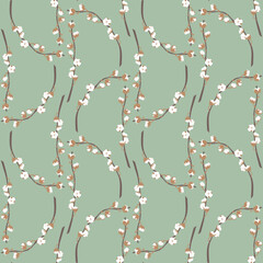 Boho seamless pattern with cotton plant on green background.
