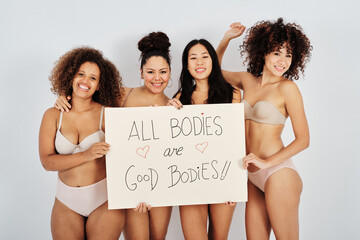 Happy multiracial women with motivational banner
