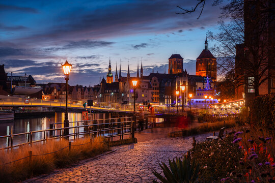 Autumnal Gdansk city reflected in the Motlawa River at dusk. Poland