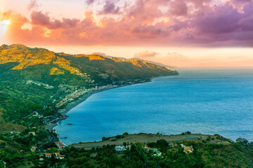 travel landscape scenic picture of beautiful highland mountain town in sunrise or sunset with sea shore on background