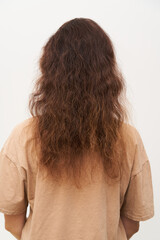 Dry and frizzy natural curly hair that needs hydration. Natural curls before salon treatment. close up. - 544838206