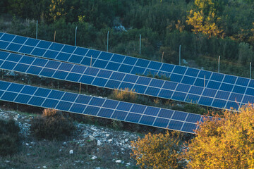 Solar power plant with polycrystalline silicon solar panel cells farm in Greece, renewable green...