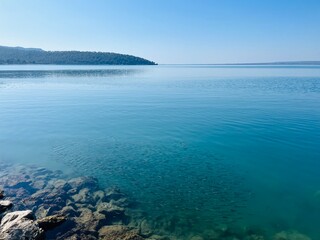 Blue sea horizon, clear blue sky and quiet sea surface