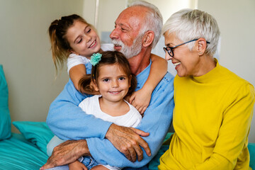 Family visiting senior male patient in hospital bed. Healthcare, support, family concept