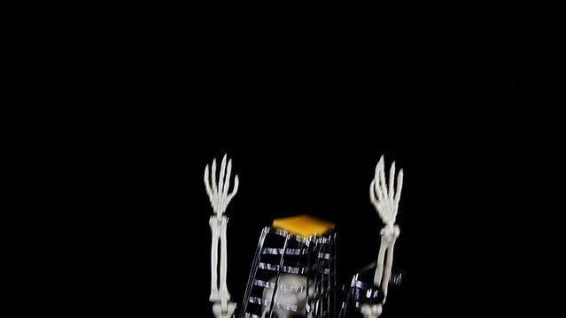 footage of sceleton trolley dark background 