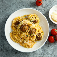 Traditional spaghetti with meatballs and tomato sauce