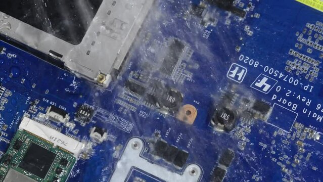Technology cyber electronic concept. Cpu processor computer under the water. CPU cooling with water. Processor under water. Damaged electronics