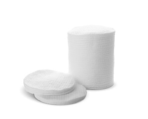 Piles of cotton pads on white background