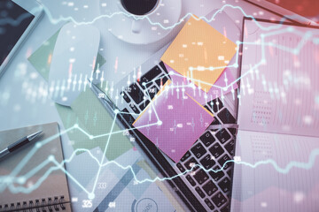 Multi exposure of financial chart drawing over table background with computer. Concept of research and analysis. Top view.