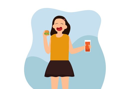 Young woman eating cheese burger and a glass of soda