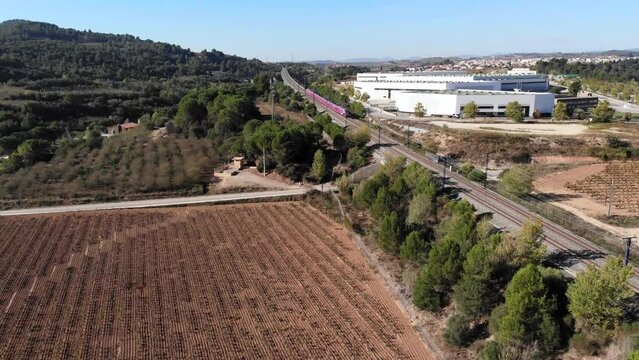 Aerial: high speed train near Barcelona, Catalonia