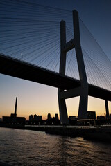 Fototapeta na wymiar sunset dawn night skylines riverside cityscape bridges colorful