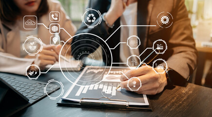 Business team working virtual modern smartphone to reduce CO2 emissions carbon footprint climate change to limit global warming.Sustainable development and green business concept. at office.