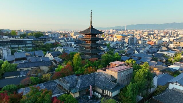 Kyoto at sunrise, aerial view of downtown Kyoto with historic Yasaka pagoda, cultural centre of Japan, flying around famous shrine of Yasaka pagoda