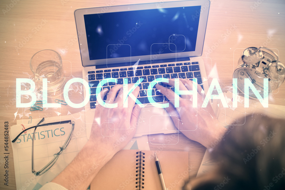 Aufkleber Double exposure of man's hands typing over computer keyboard and crypto currency theme hologram drawing. Top view. Blockchain concept.