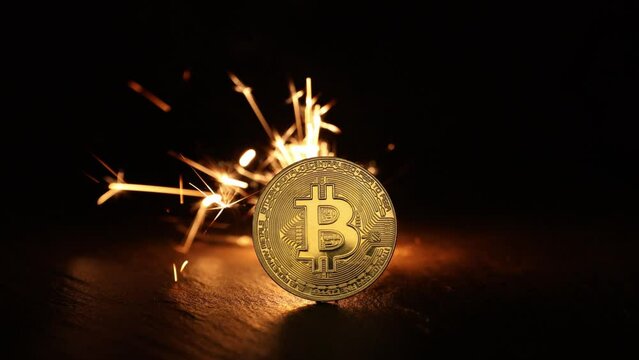 Digital bitcoins with fire sparks in the back
