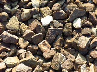 gravel lies in the summer between the railway rails