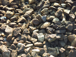 gravel lies in the summer between the railway rails