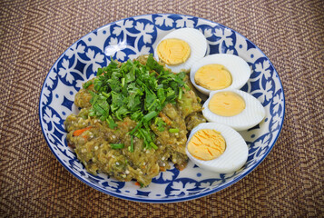Spicy eggplants salad or Tum-Ma-kea in plate, Thai famous northern food.
