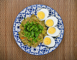 Spicy eggplants salad or Tum-Ma-kea in plate, Thai famous northern food.
