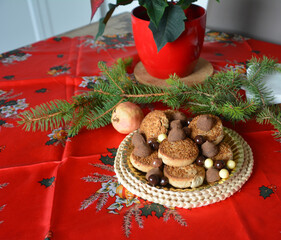 Christmas cookies on a plate on a decorated table. Dessert of cookies plate perfect for celebrating Christmas.