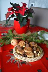 Christmas cookies on a plate on a decorated table. Dessert of cookies plate perfect for celebrating Christmas.