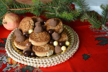 Christmas cookies on a plate on a decorated table. Dessert of cookies plate perfect for celebrating Christmas.