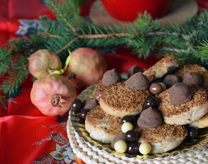 Christmas cookies on a plate on a decorated table. Dessert of cookies plate perfect for celebrating Christmas.