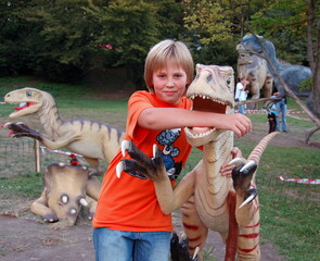 child playing with dinosaurs