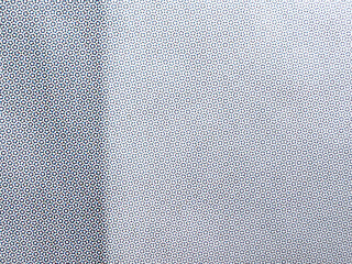 Cmyk halftone dot pattern on print paper as abstract background