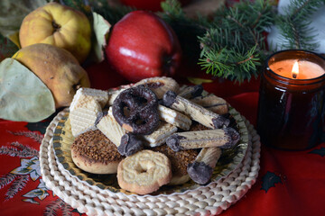 Lovely close up image of Christmas cookies decorated on a plate on a table.