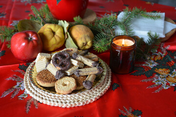 Lovely close up image of Christmas cookies decorated on a plate on a table.