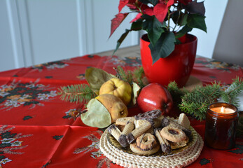 Lovely close up image of Christmas cookies decorated on a plate on a table.
