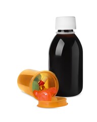 Bottle of syrup with pills on white background. Cough and cold medicine
