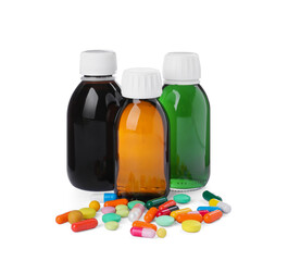 Bottles of syrups with pills on white background. Cough and cold medicine