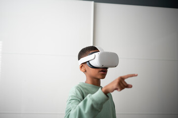 Boy using virtual reality headset at home