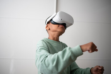 Boy using virtual reality headset at home