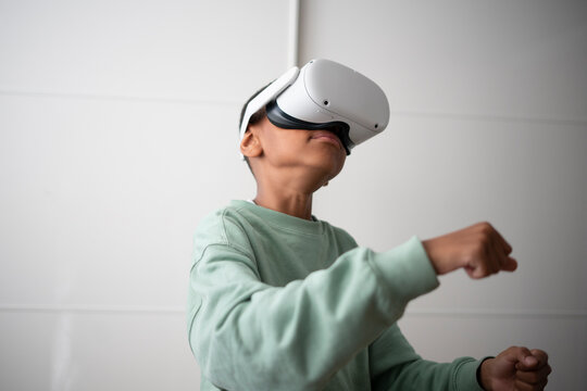 Boy using virtual reality headset at home